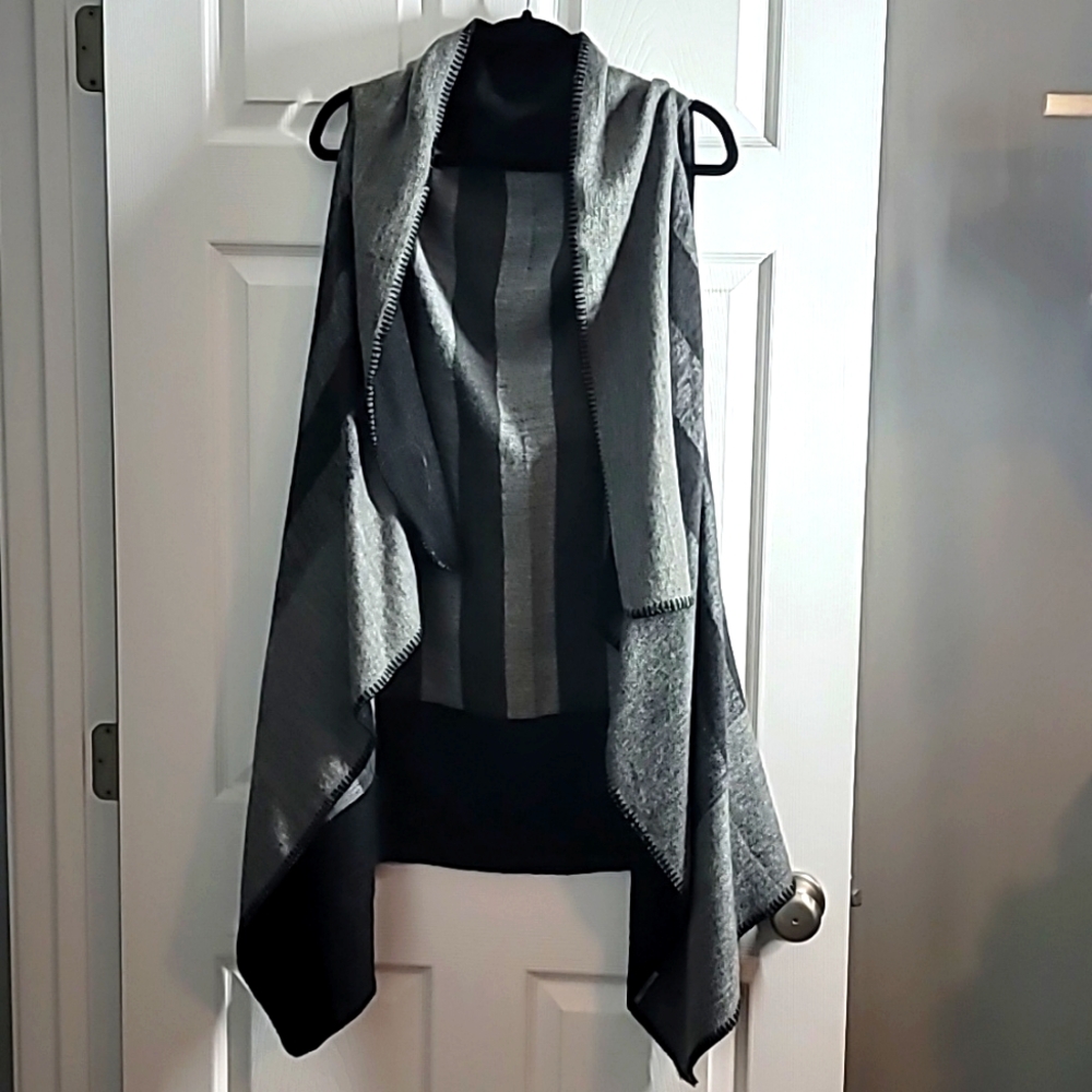 Sleeveless, open front sweater